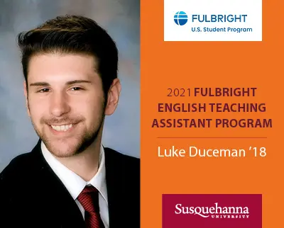 A person in a suit and tie smiles in a formal portrait next to a Fulbright U.S. Student Program logo. Text reads: 