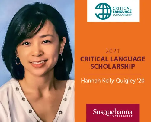 A woman with short dark hair smiles against a light blue background. Text beside her reads: 