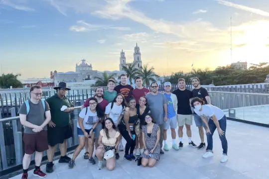 Students take a group photo in a Spanish-speaking city
