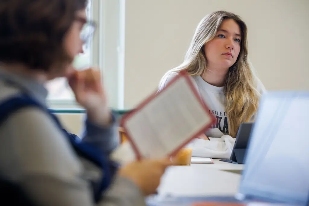 Women & Gender studies students are sitting in a classroom.