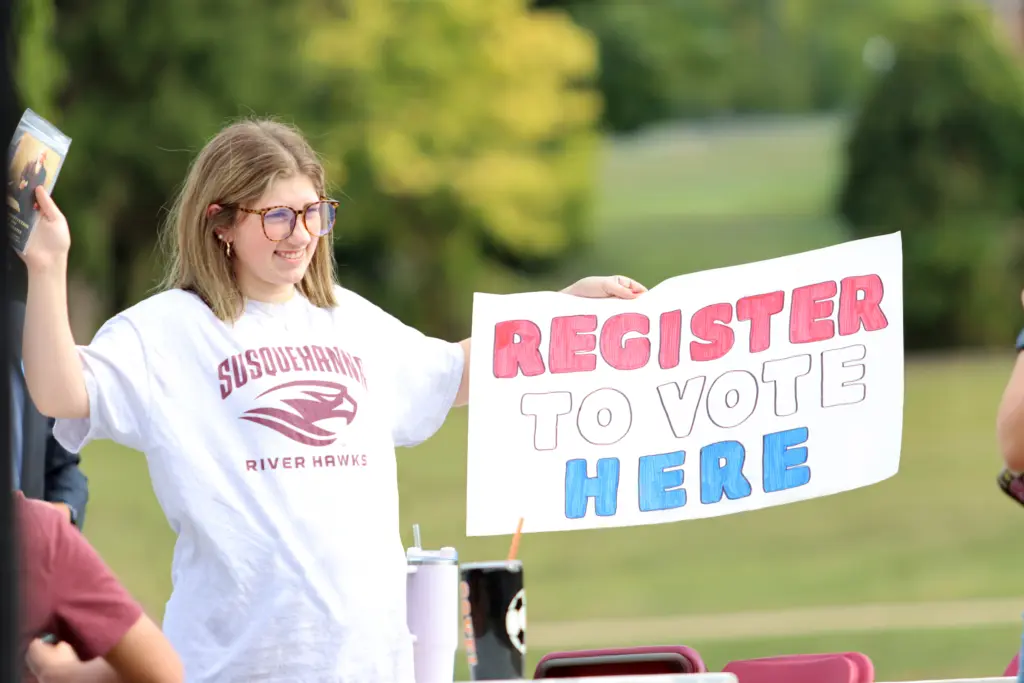 A person wearing glasses and a 