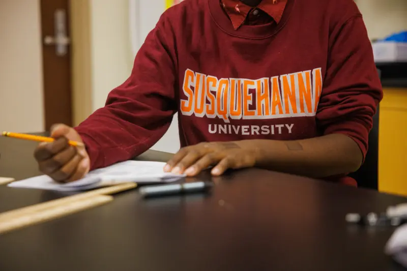 Person wearing a maroon 